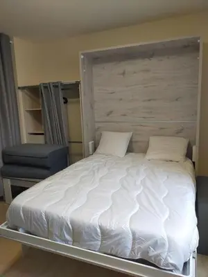 Un ou plusieurs lits dans un hébergement de l'établissement Studio 1 - Mont Dore face aux Thermes - Hyper-Centre