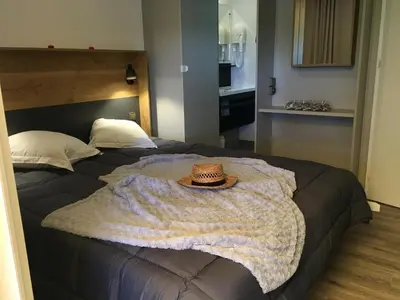 Un ou plusieurs lits dans un hébergement de l'établissement Flower Camping de Rouffiac