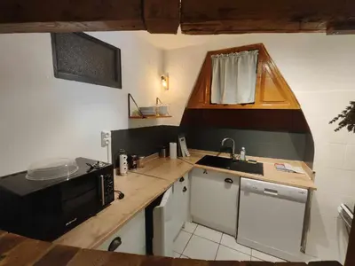 Cuisine ou kitchenette dans l'établissement Appartement avec terrasse