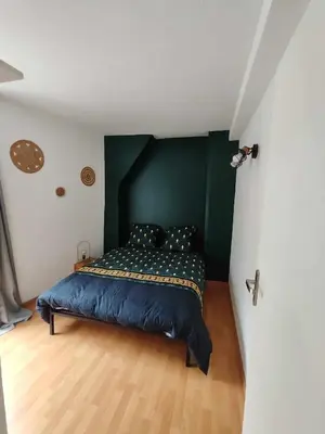 Un ou plusieurs lits dans un hébergement de l'établissement Appartement avec terrasse