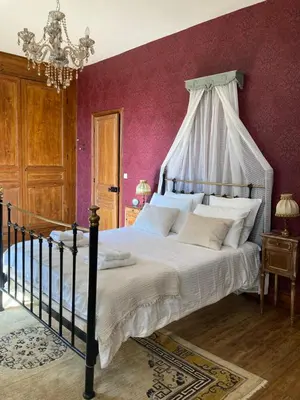 Un ou plusieurs lits dans un hébergement de l'établissement Chateau Gioux