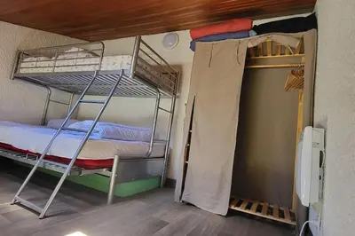 Un ou plusieurs lits superposés dans un hébergement de l'établissement Logement saisonnier la bourboule