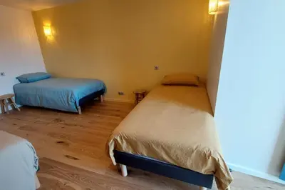 Un ou plusieurs lits dans un hébergement de l'établissement Gite 8 personnes Ussel Grande Maison rénovée