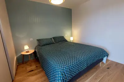 Un ou plusieurs lits dans un hébergement de l'établissement Gite 8 personnes Ussel Grande Maison rénovée