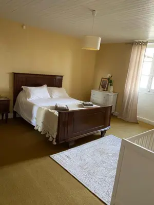 Un ou plusieurs lits dans un hébergement de l'établissement Maison de vacances