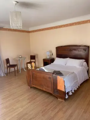 Un ou plusieurs lits dans un hébergement de l'établissement Maison de vacances