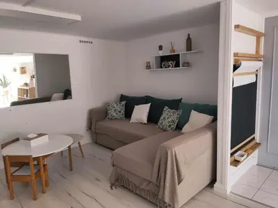 Coin salon dans l'établissement Appartement cosy avec extérieur à Bretenoux