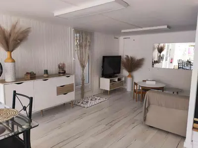 Télévision ou salle de divertissement dans l'établissement Appartement cosy avec extérieur à Bretenoux