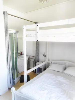 Un ou plusieurs lits dans un hébergement de l'établissement Le Beau Site appartement chaleureux et lumineux tout a pieds
