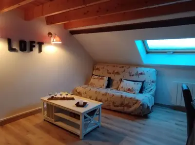 Coin salon dans l'établissement Appartement La Calèche classé 3 étoiles