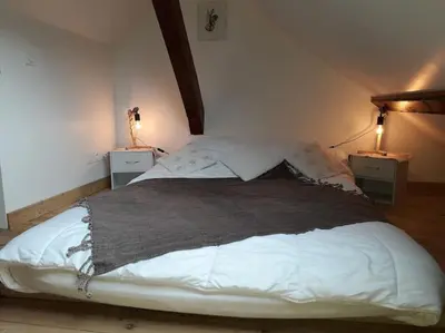 Un ou plusieurs lits dans un hébergement de l'établissement Appartement La Calèche classé 3 étoiles