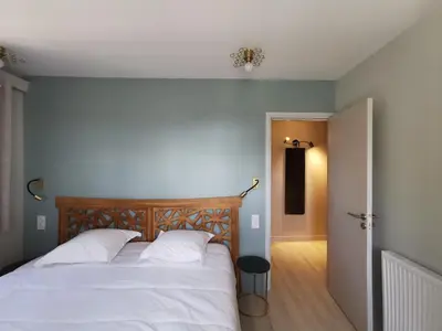 Un ou plusieurs lits dans un hébergement de l'établissement Domaine Jolidetour climatisé, piscine et tennis privés