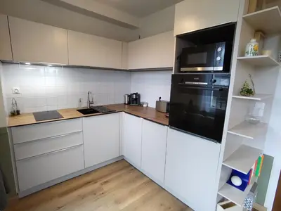 Cuisine ou kitchenette dans l'établissement Appartement cosy avec Jardin clôturé