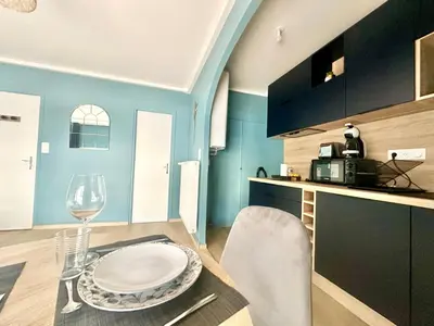 Cuisine ou kitchenette dans l'établissement Le Palmier Doré, central et élégant