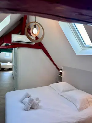 Un ou plusieurs lits dans un hébergement de l'établissement Maison d'Antan - PiscineJardinClim - Bourg de Cuzance