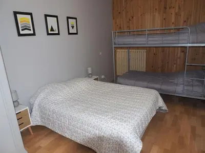 Un ou plusieurs lits dans un hébergement de l'établissement Appartement Mont-dore centre 6-8 personnes 2 ch