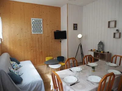 Coin salon dans l'établissement Appartement Mont-dore centre 6-8 personnes 2 ch
