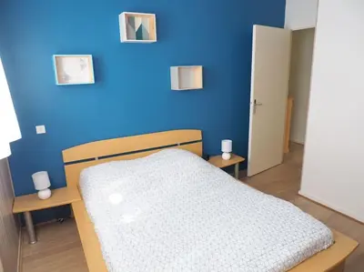Un ou plusieurs lits dans un hébergement de l'établissement Appartement Mont-dore centre 6-8 personnes 2 ch