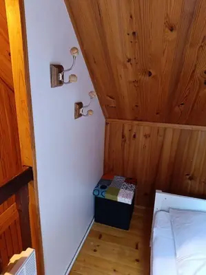 Un ou plusieurs lits dans un hébergement de l'établissement Charmant Chalet de montagne