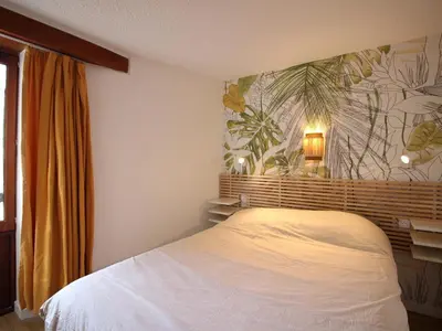 Un ou plusieurs lits dans un hébergement de l'établissement Bel appartement T2 avec balcon et parking au Mont-Dore - FR-1-608-271