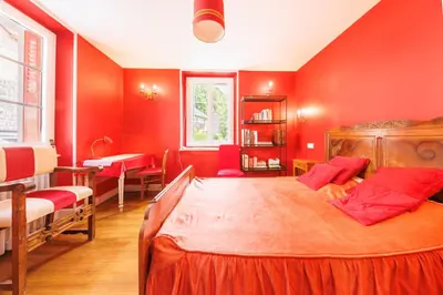 Un ou plusieurs lits dans un hébergement de l'établissement L'Arverne du Rocher - Maison vue montagne