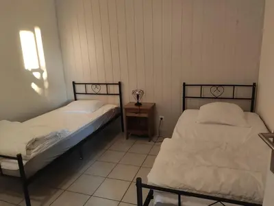 Un ou plusieurs lits dans un hébergement de l'établissement Gîte en bord de lac
