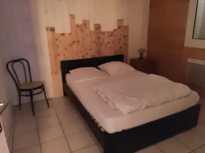 Un ou plusieurs lits dans un hébergement de l'établissement Gîte en bord de lac