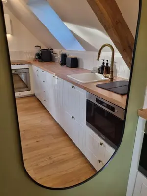 Cuisine ou kitchenette dans l'établissement Le perchoir de Pibri - Les apparts de Maddy