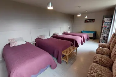 Un ou plusieurs lits dans un hébergement de l'établissement Gîte 10 pers pmr saint flour
