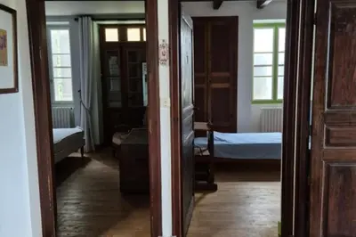 Un ou plusieurs lits dans un hébergement de l'établissement Ma maison de famille en Quercy avec piscine