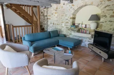 Coin salon dans l'établissement Maison de charme Portobelo dans Carennac avec vue