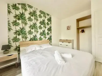 Un ou plusieurs lits dans un hébergement de l'établissement L'Oasis, lumineux et zen