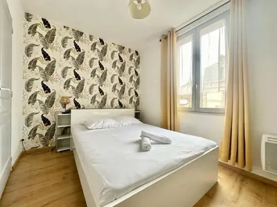 Un ou plusieurs lits dans un hébergement de l'établissement Le Saint Georges, cosy et calme