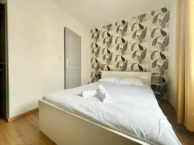 Un ou plusieurs lits dans un hébergement de l'établissement Le Saint Georges, cosy et calme