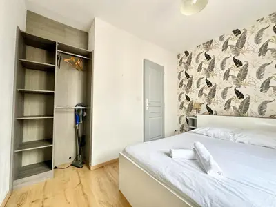 Un ou plusieurs lits dans un hébergement de l'établissement Le Saint Georges, cosy et calme