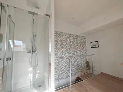 Salle de bains dans l'établissement Le Chistera, zen et intimiste