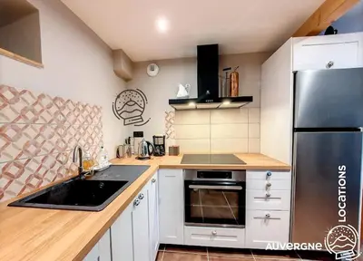 Cuisine ou kitchenette dans l'établissement Le Cantou de La Mouche