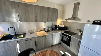 Cuisine ou kitchenette dans l'établissement Au Cœur du Mont Dore 6 personnes