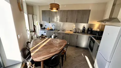 Cuisine ou kitchenette dans l'établissement Au Cœur du Mont Dore 6 personnes