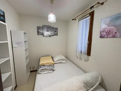 Un ou plusieurs lits dans un hébergement de l'établissement Confortable T2 avec balcon au cœur de la station, proche pistes et commerces - FR-1-787-80