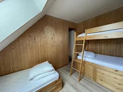Un ou plusieurs lits dans un hébergement de l'établissement Duplex cosy 6-8 pers. pieds des pistes avec balcon - FR-1-787-88