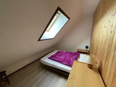 Un ou plusieurs lits dans un hébergement de l'établissement Duplex cosy 6-8 pers. pieds des pistes avec balcon - FR-1-787-88
