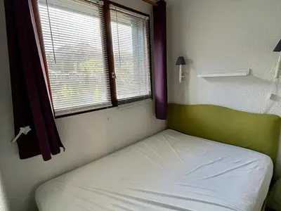 Un ou plusieurs lits dans un hébergement de l'établissement Duplex T3 balcon au cœur du Lioran, proche pistes - FR-1-787-89