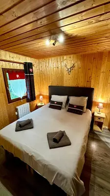 Un ou plusieurs lits dans un hébergement de l'établissement Chalet Le Salers 10pers Le Mont Dore