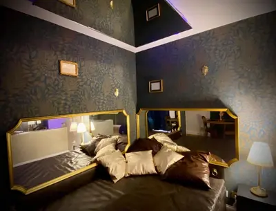 Un ou plusieurs lits dans un hébergement de l'établissement Love Room Plaisir Secret