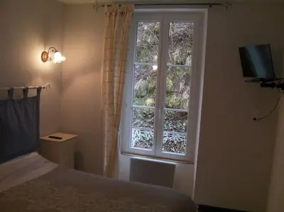 Un ou plusieurs lits dans un hébergement de l'établissement Appartement à la montagne
