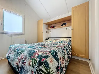 Un ou plusieurs lits dans un hébergement de l'établissement Au chalet 29