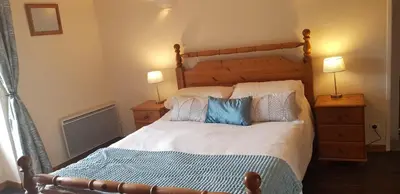 Un ou plusieurs lits dans un hébergement de l'établissement Meadow View Gîtes - Grande gîtes pour familles et groupes, piscine chauffée - Janaillat, Creuse, France, 23250