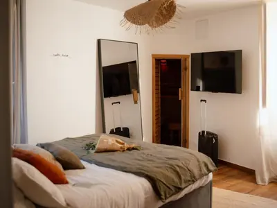Un ou plusieurs lits dans un hébergement de l'établissement Suite Cara - Logement Atypique Sauna Balneo - Centre Historique