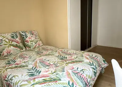Un ou plusieurs lits dans un hébergement de l'établissement La Maisonnette de Limoges - 8 chambres